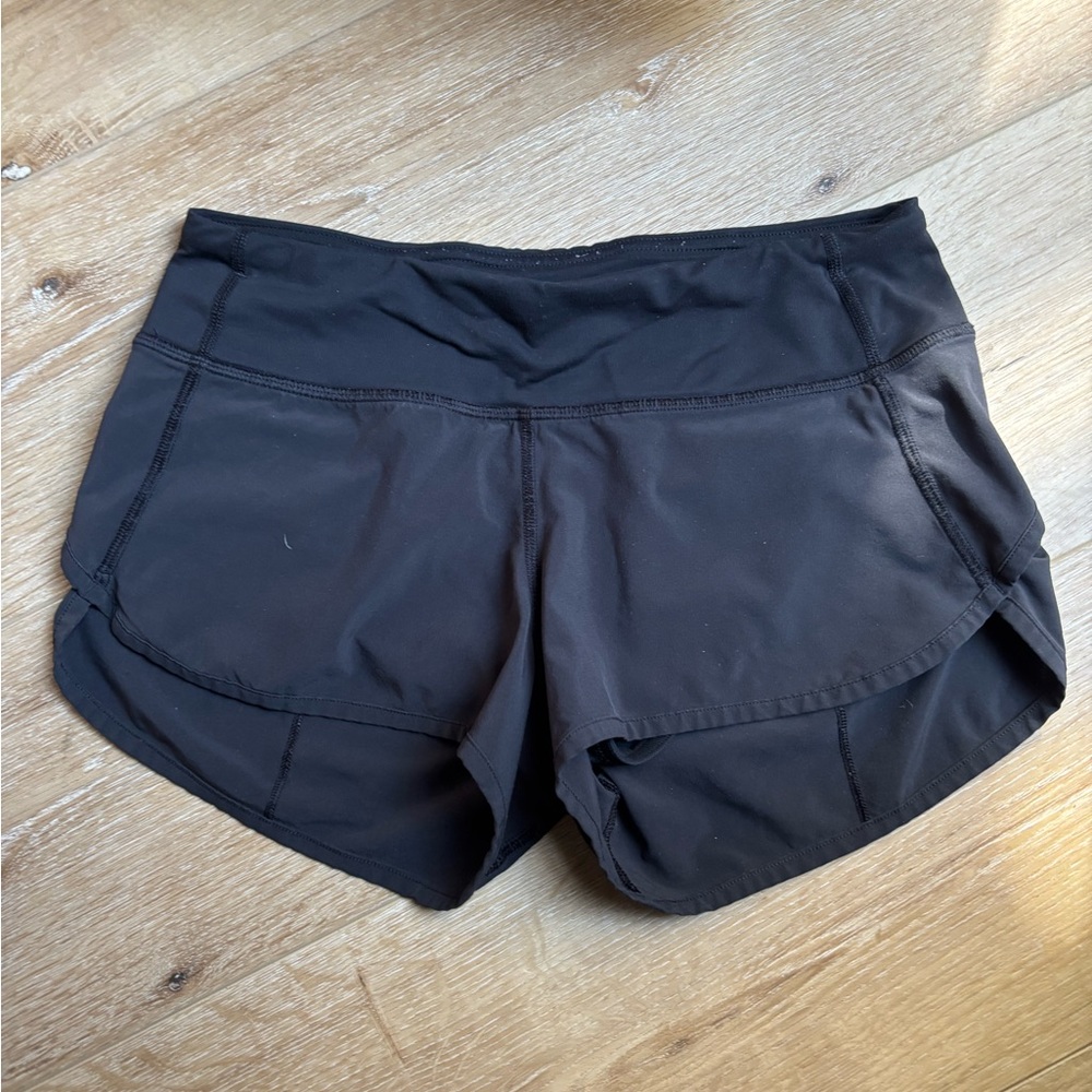 Lululemon black shorts - Size 0 - Zipper pocket on back. Super comfy / CUTE!